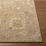 Close up of the beige Lanune Traditional Handmade Area Rug showing texture and floral pattern. Front