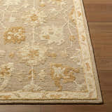 Close-up of the hand-tufted Pubyli Traditional Handmade Area Rug showing the ivory, taupe, and yellow floral pattern. Front