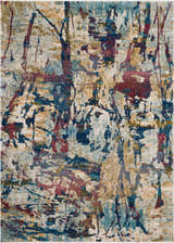 Close-up of Nourison Fusion Cream Multicolor rug. Abstract pattern with cream, blue, red, and gold tones.