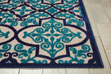 Close-up of the Nourison Aloha Navy Bohemian Area Rug showing the navy and teal floral pattern and texture.
