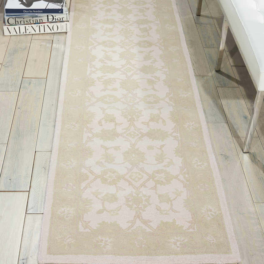 Hallway scene with Nourison Zephyr Ivory/Green runner rug, floral pattern, on light hardwood floor with white bench.