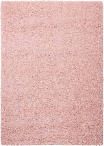 Close-up of a plush Nourison Amore Blush Shag rug, showing its soft texture and light pink color.