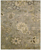 Close-up of the Nourison Jaipur Silver Floral Area Rug. Wool rug with a gray background and a delicate floral pattern.