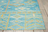 Close-up of Nourison Madera Sky Blue Tribal Rug. Geometric pattern in sky blue, gold, and white.