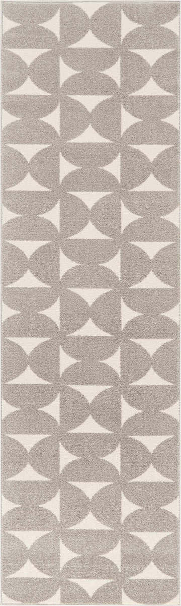 Close-up of Nourison Harper Grey Colorful rug featuring a geometric pattern of gray circles and triangles.