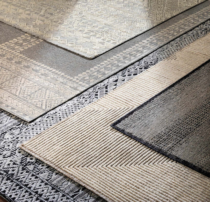 Close-up of Hemyock Premium Wool&Viscose Carpet in black, charcoal, and off-white. Features hand-knotted Bohemian designs. Styleshot