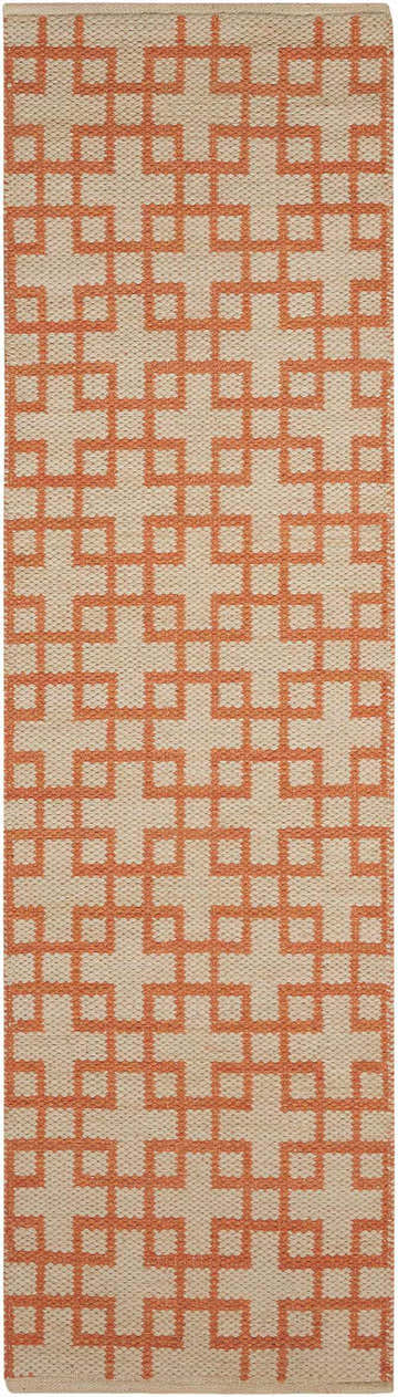 Close-up of the Barclay Butera Maze Mango area rug. Features a geometric maze pattern in mango on a neutral background.