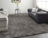 Modern living room with black sofa and white chairs featuring the Feizy Darian Gray Area Rug. Roomscene-Rectangle