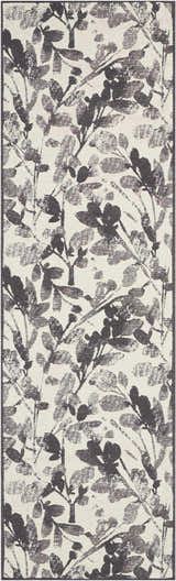 Close-up of the Waverly Vintage Lux Graphite rug, featuring a modern floral leaf pattern in graphite and cream.