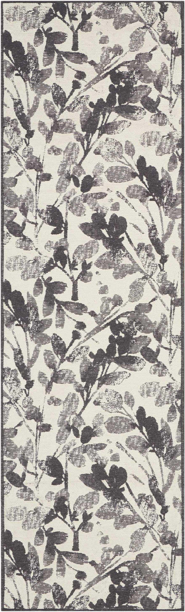 Close-up of the Waverly Vintage Lux Graphite rug, featuring a modern floral leaf pattern in graphite and cream.