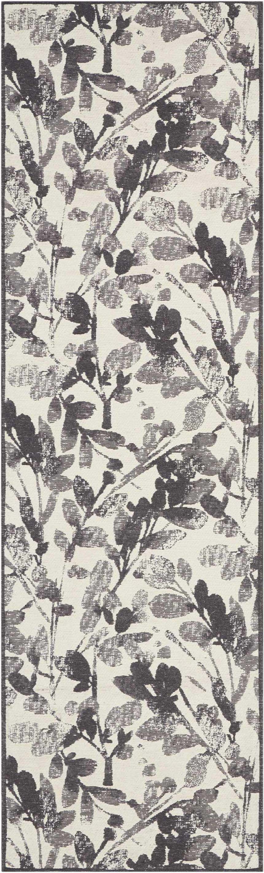 Close-up of the Waverly Vintage Lux Graphite rug, featuring a modern floral leaf pattern in graphite and cream.