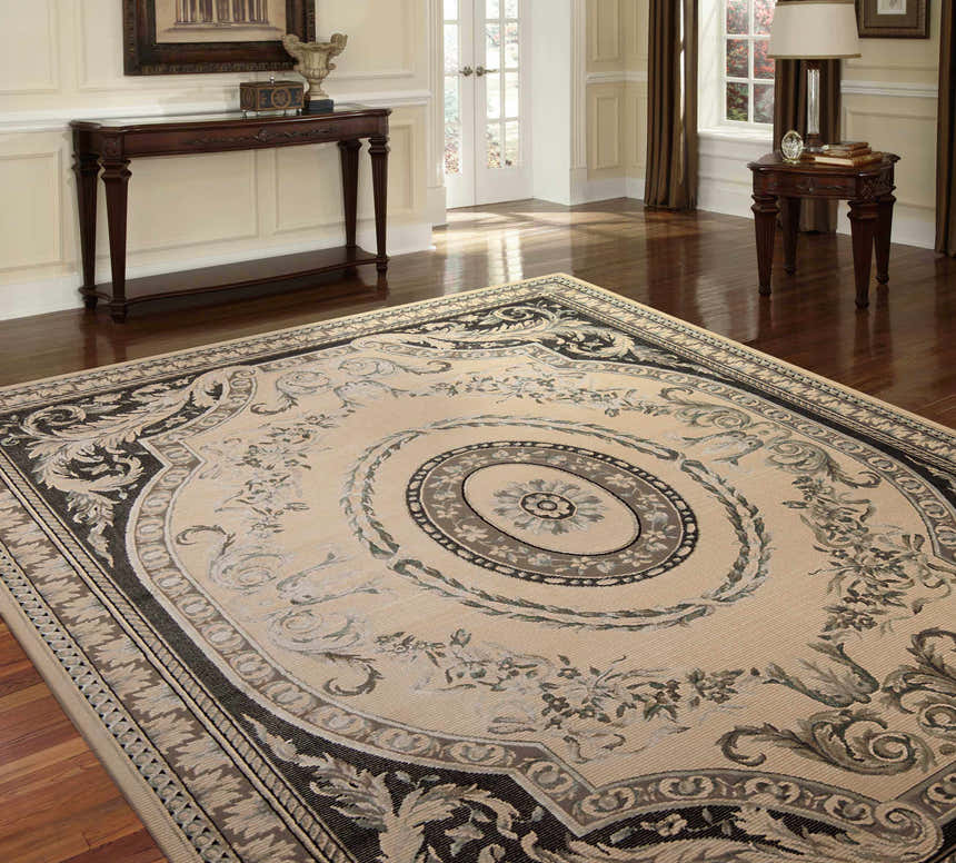 Elegant living room with Michael Amini Platine Ivory Vintage Area Rug, chestnut wood furniture, and natural light.