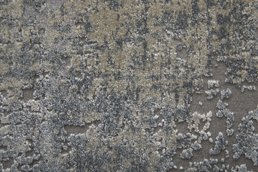 Close-up of the Feizy Cadiz rug. Abstract pattern in taupe, gray, and silver with a soft, textured pile. Texture