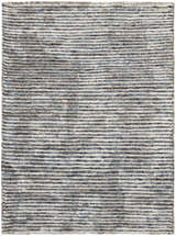 Close-up of the handmade Nourison Ellora Slate area rug. Taupe, gray, and subtle blue horizontal stripes create a modern texture.