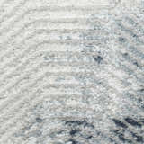 Close up of the high pile Nourison Dekor Grey Navy rug showing texture and pattern.