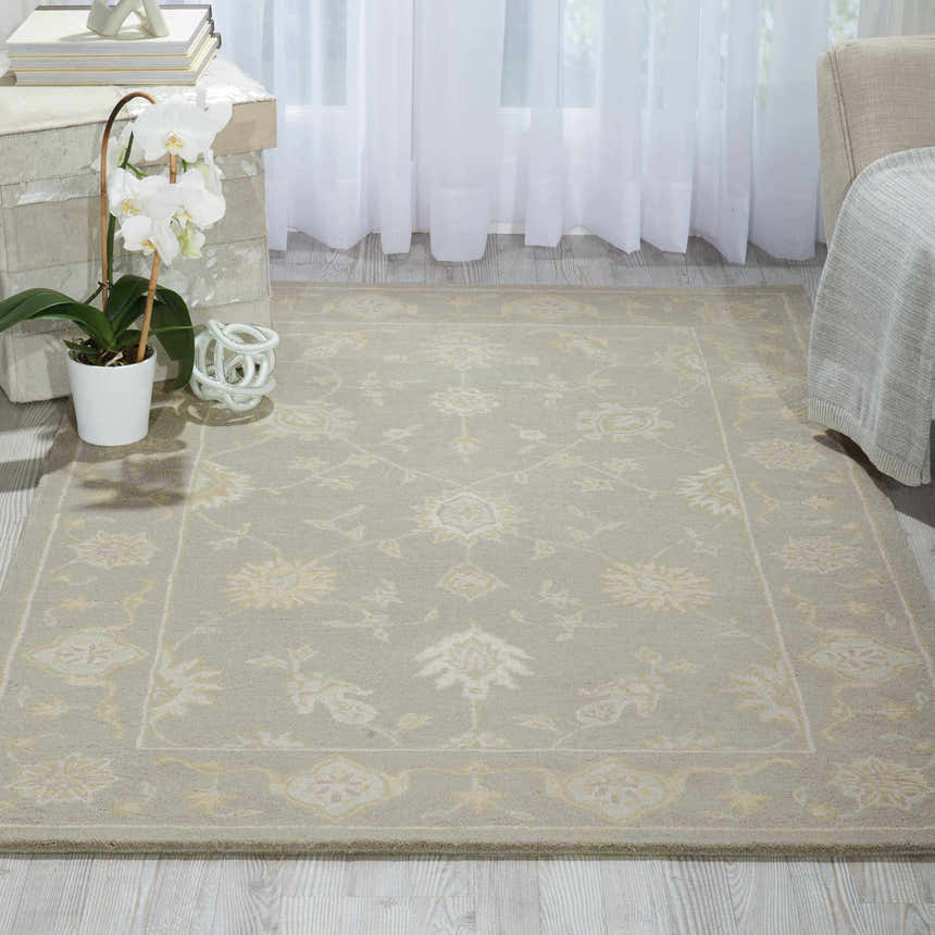 Living room scene with a Nourison Zephyr Light Taupe rug, floral pattern, ivory accents, on light wood floors.