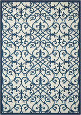 Close-up of Nourison Home & Garden Blue Farmhouse Area Rug. Features a light blue ornate trellis pattern on a cream background.