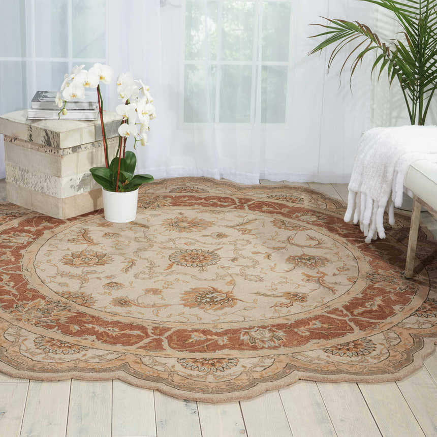 Bright room with round Nourison Heritage Hall Mist Persian rug, floral pattern, near white bench and orchid.