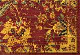 Close-up of the Nourison Timeless Pomegranate Persian Rug. Features a detailed floral pattern in reds, yellows, and greens.
