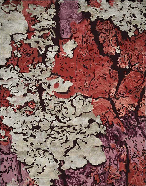 Close-up of the painterly Nourison Prismatic Multicolor area rug, featuring red, white, and purple abstract shapes.