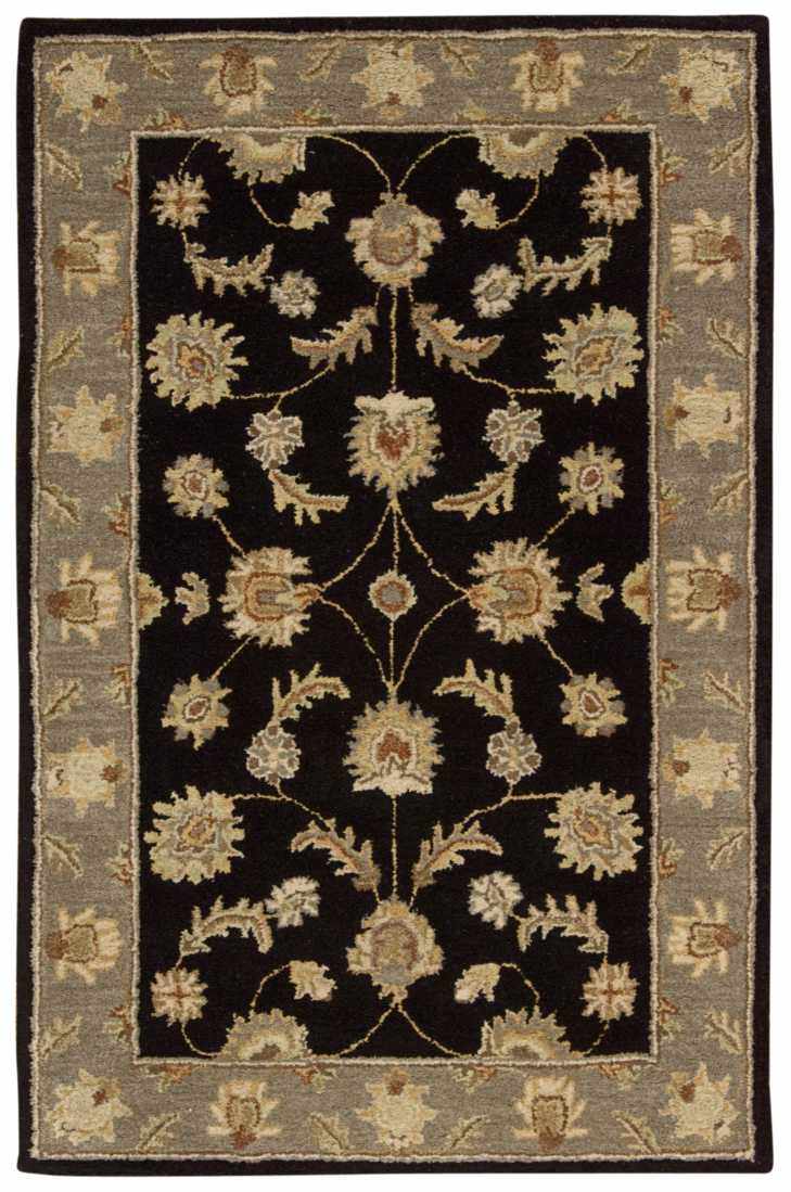 Close-up of the Nourison India House Black Persian rug, featuring a floral design and gray border.
