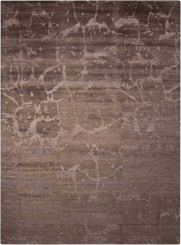 Close-up of the Nourison Silk Shadows Brown rug. Abstract pattern in shades of brown with silk-like texture.