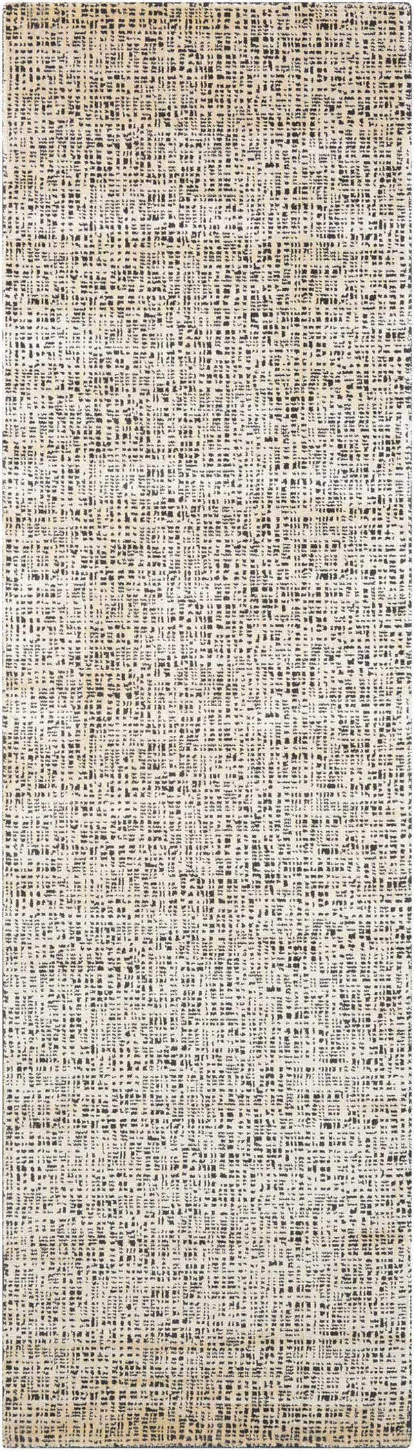 Close-up of the Nourison Starlight Midnight Rug. Modern design with black and ivory pattern. Machine-made luxcelle texture.