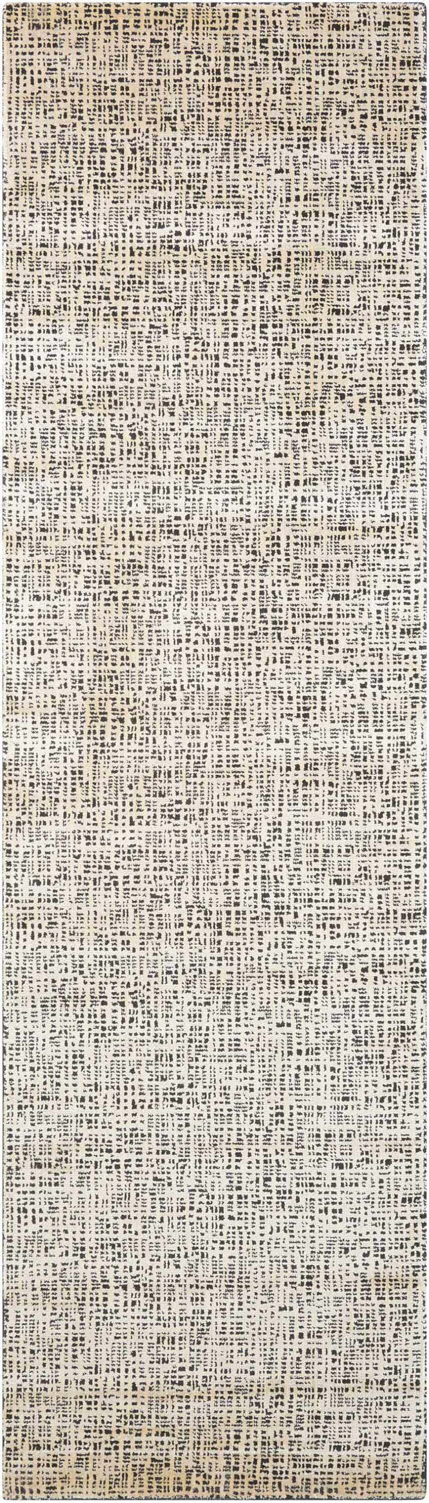 Close-up of the Nourison Starlight Midnight Rug. Modern design with black and ivory pattern. Machine-made luxcelle texture.