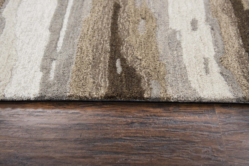 Close-up of the hand-tufted Rizzy VOG101 area rug. Beige, dark red, and cream wool with a contemporary abstract pattern. Pile