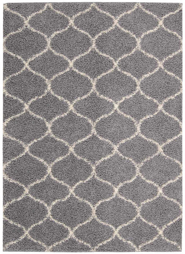 Close-up of the Nourison Windsor Silver Shag Rug, featuring a gray shag pile and a cream-colored Moroccan trellis pattern.