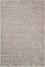 Close-up of the gray Nourison Escalade Granite area rug featuring a unique, abstract cracked pattern.