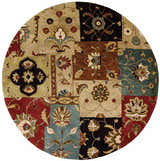 Close-up of a round Nourison Jaipur Multicolor Persian rug with a patchwork floral design in red, teal, beige, brown, and black.