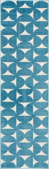 Close-up of Nourison Harper Blue rug, featuring a geometric pattern of blue semi-circles and white triangles.
