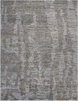 Close up of the Nourison Ellora Slate rug. Taupe, horizontal striations with a subtle, abstract pattern. Handmade rayon rug.