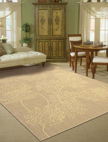 Traditional living room with a Nourison Capri Sand Floral Area Rug, chaise lounge, chess table, and green walls.