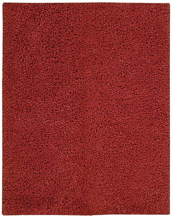 Close-up of the Nourison Zen Red Shag Rug showing its dense, soft texture and rich red color. Handmade shag rug detail.