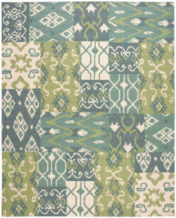 Close-up of the Nourison Vista Multicolor rug. Features a patchwork design with green, teal, and cream geometric patterns.