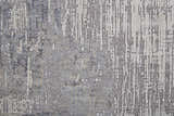 Close-up of the Feizy Lennon Taupe/Tan/Blue Area Rug. Abstract design with textured pile and subtle color variations. Texture