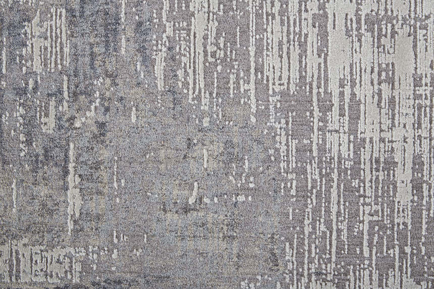 Close-up of the Feizy Lennon Taupe/Tan/Blue Area Rug. Abstract design with textured pile and subtle color variations. Texture
