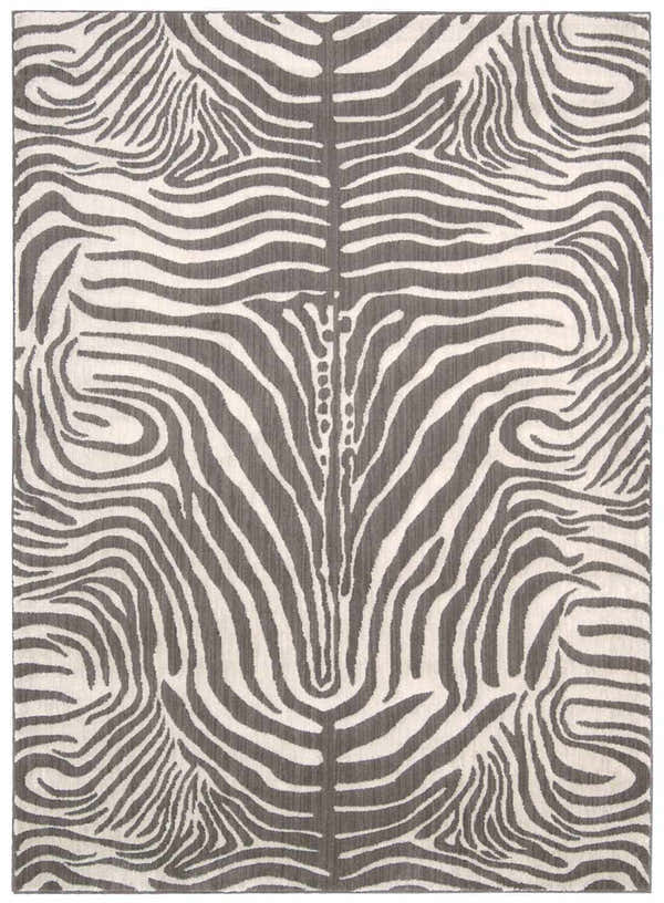 Close-up of Barclay Butera Madagascar Graphite rug featuring a gray and white zebra stripe pattern.