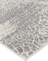 Close-up of the Feizy Azure Modern Watercolor rug in gray, blue, and ivory. Abstract pattern. Corner