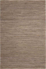 Close-up of the Calvin Klein Monsoon Loam rug showing its jute texture and horizontal lines in brown and beige.