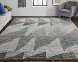 Living room with Feizy Alford Ivory/Gray/Taupe rug, white sofa, gray chair, and geometric wall art. Roomscene-Rectangle