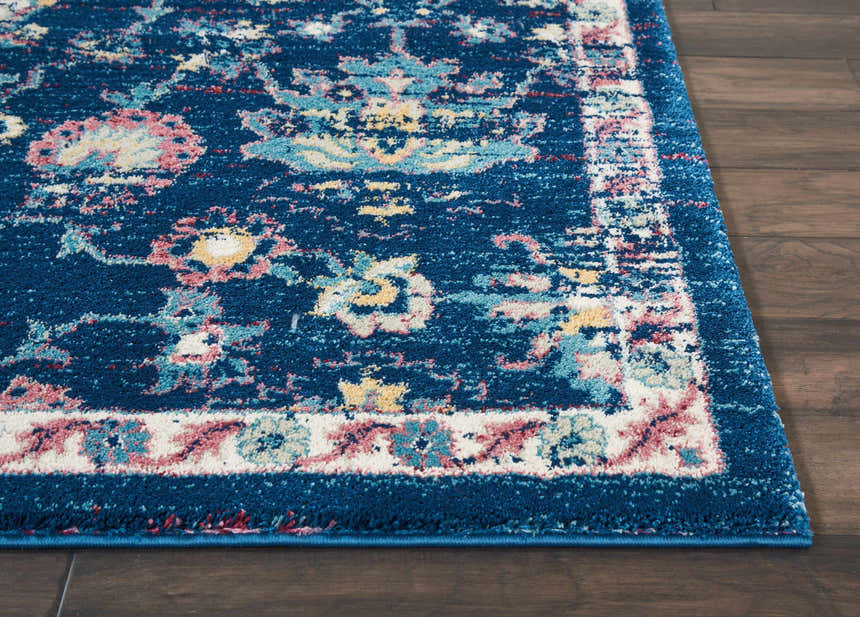 Close-up of Nourison Fusion Navy Pink Persian rug showing floral pattern, texture, and navy border.