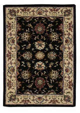 Close-up of the Nourison 2000 Navy Persian Area Rug. Handmade wool rug with floral Persian design and ivory border.