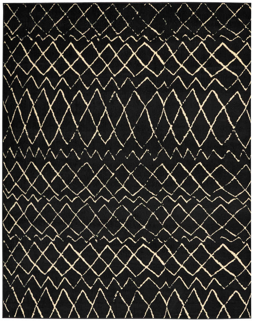 Close-up of Nourison Grafix Black Bohemian rug with geometric diamond and zig zag pattern. Black and cream colors.