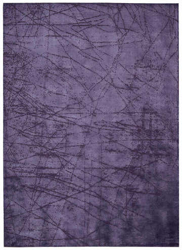 Close-up of the Calvin Klein Home Maya Orchid rug; a purple handmade rug with a subtle linear pattern.