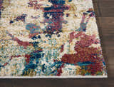 Close-up of Nourison Fusion Cream Multicolor rug showing abstract pattern and texture on dark wood floor.