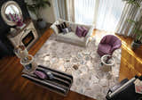 Elegant living room with a Michael Amini City Chic Silver rug, sofa, piano, and fireplace.