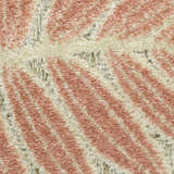Close-up of the Nourison Aloha Sage Rose rug showing its rose and ivory diagonal stripe pattern and textured pile.